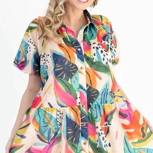 The catalog photograph of the printed dress, worn by a hired model against a white background